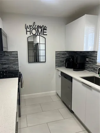 a kitchen with a stove and a microwave