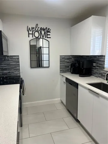 a kitchen with a stove and a microwave