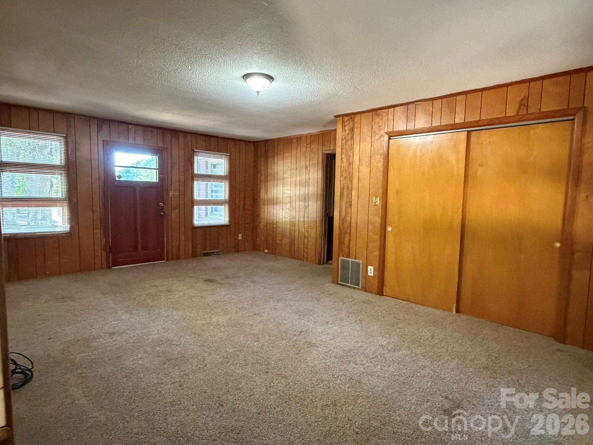 382 Alexis High Shoals Road Dallas, NC 28034 - Photo 13 of 43 a view of an empty room with window and stairs