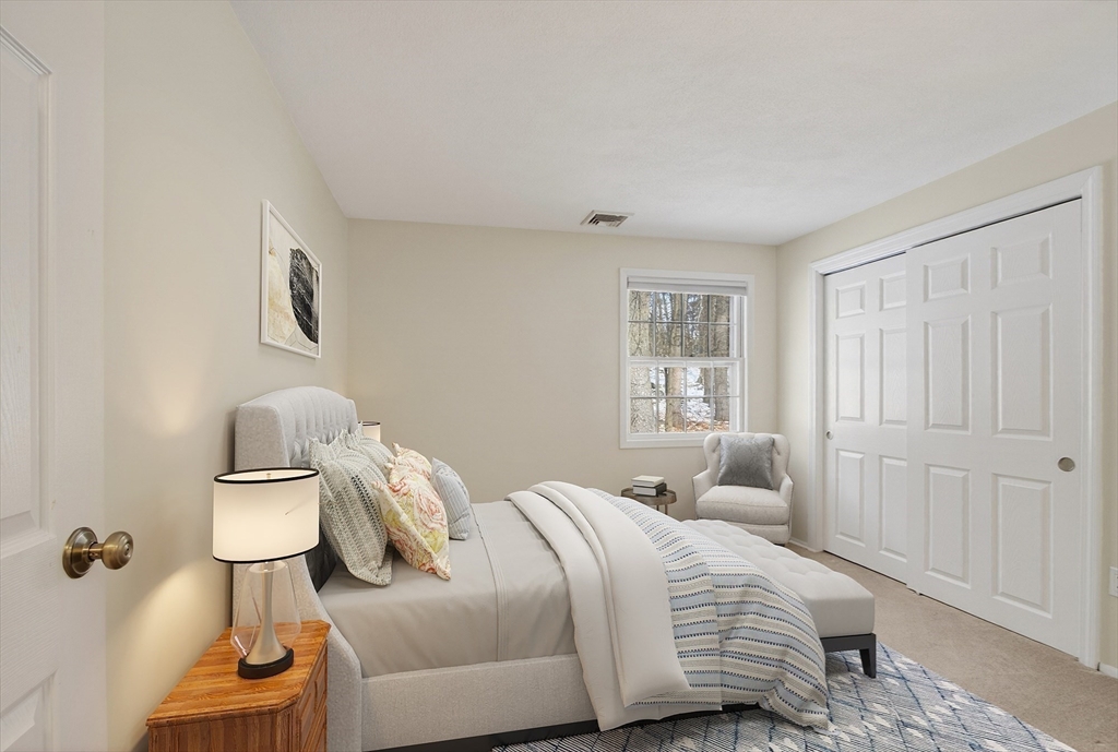 11 Smoke Rise Drive Chelmsford, MA 01824 - Photo 21 of 28 a bedroom with a bed and a window