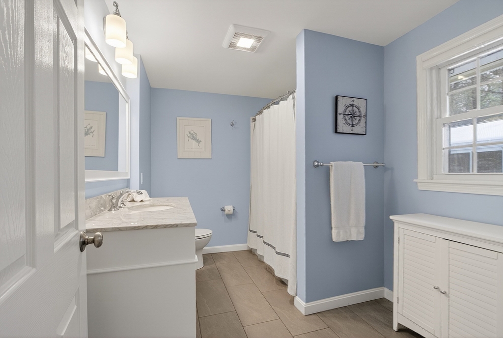 11 Smoke Rise Drive Chelmsford, MA 01824 - Photo 24 of 28 a bathroom with a sink toilet and window