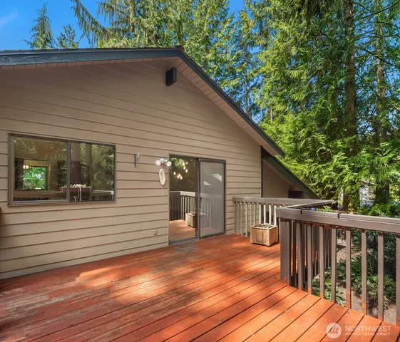 a view of a house with wooden deck