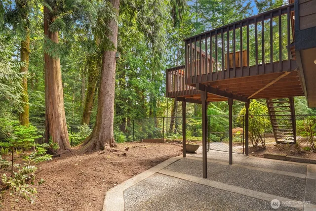 a view of a wooden deck with a backyard