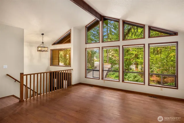 a view of an entryway with wooden floor