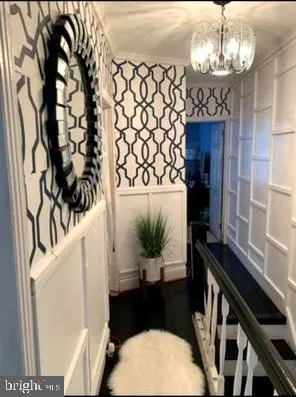 a view of a living room and a chandelier