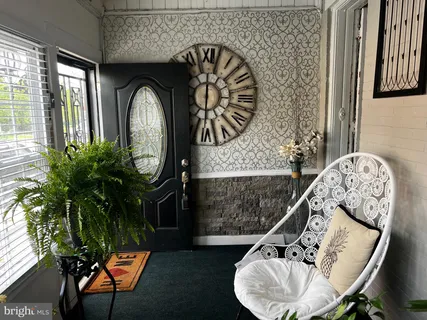 a view of entryway with wooden floor