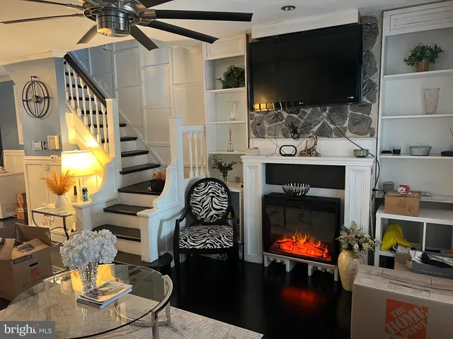 a room with fireplace furniture and a flat screen tv