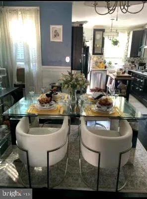 a kitchen with a dining table and chairs