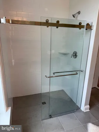 a living room with furniture a fireplace and a potted plant