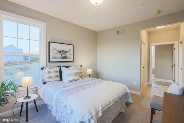 a en suite bathroom with double sink and a mirror