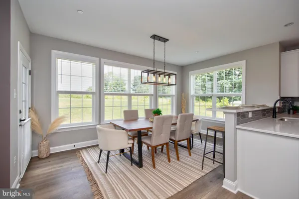 a view of a livingroom with workspace and a window