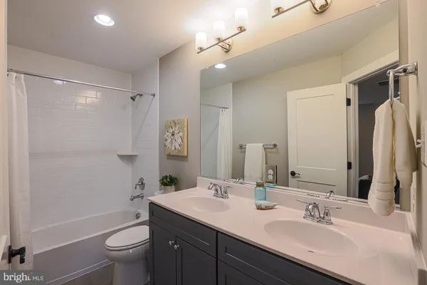 a bed room with a bed and a chair