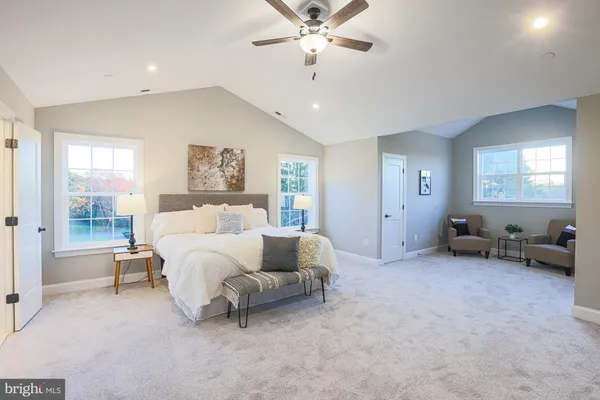 a bed room with a bed and a chair