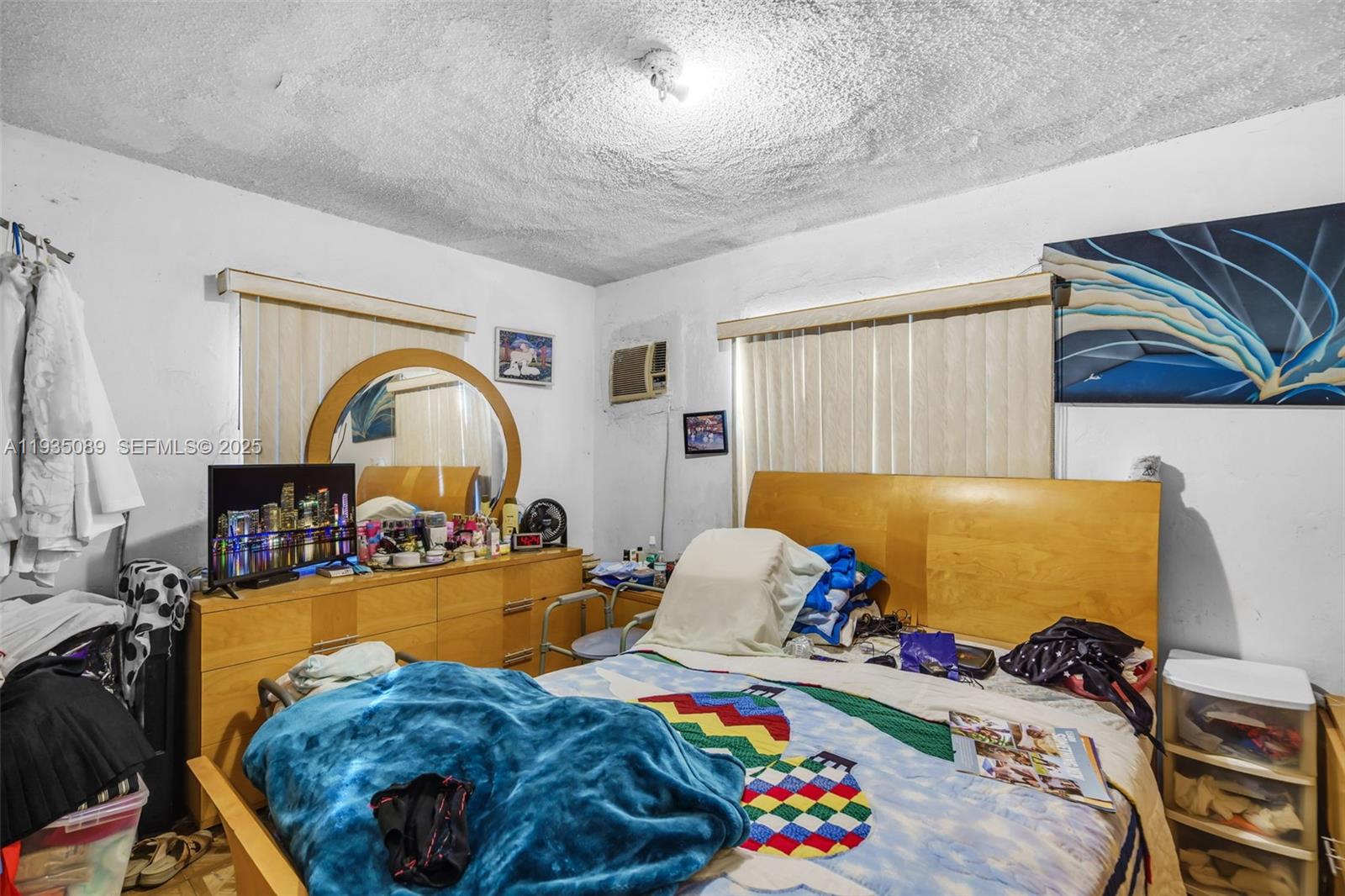 191 Northwest 83rd Street Miami, FL 33150 - Photo 16 of 35 a bed sitting in a bedroom next to a window
