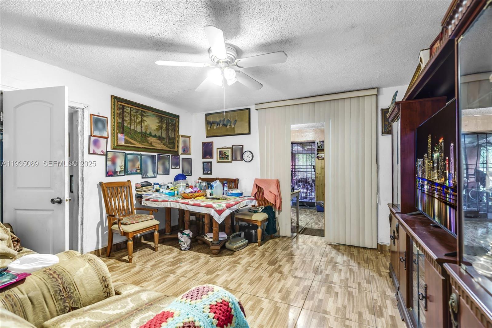 191 Northwest 83rd Street Miami, FL 33150 - Photo 7 of 35 a bed room with a bed and a book shelf