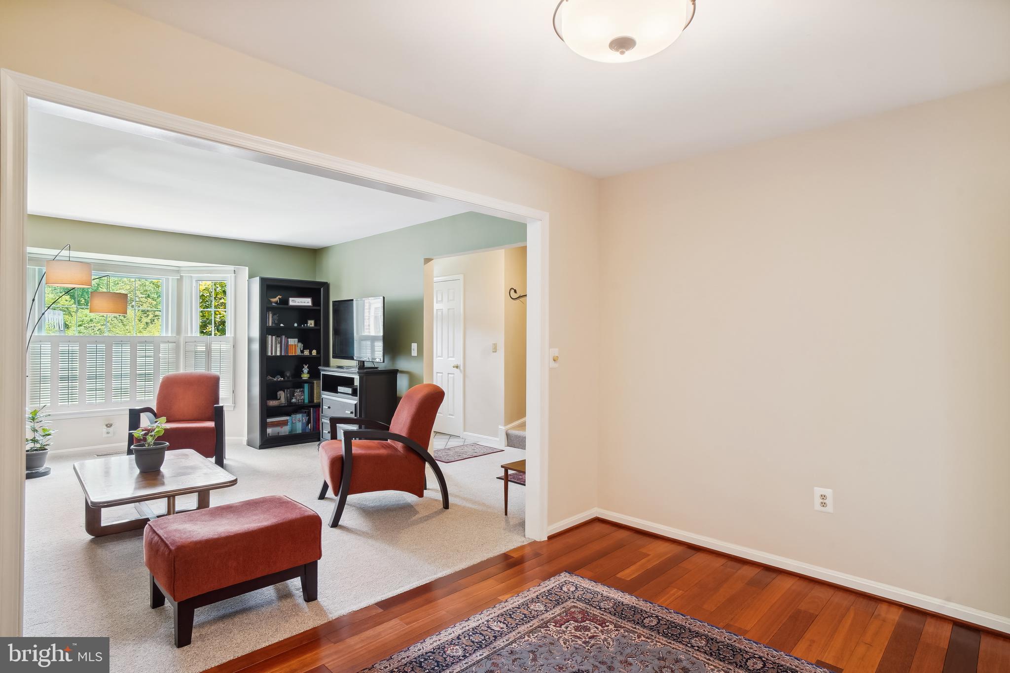 1049 Windrush Lane, Unit 2 Sandy Spring, MD 20860 - Photo 16 of 59 a living room with furniture