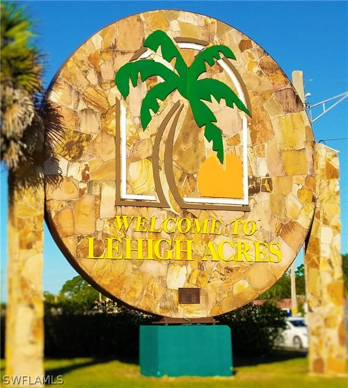 2910 25th Street West Lehigh Acres, FL 33971 - Photo 13 of 15 a view of swimming pool with a garden