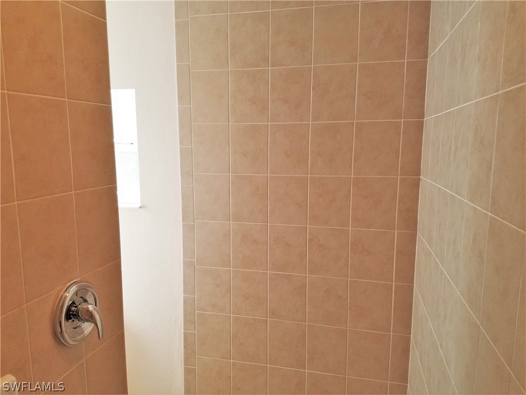 2910 25th Street West Lehigh Acres, FL 33971 - Photo 9 of 15 a bathroom with a shower