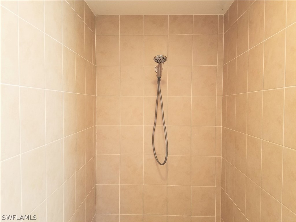 2910 25th Street West Lehigh Acres, FL 33971 - Photo 10 of 15 a bathroom with a shower
