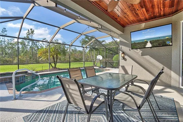a backyard of a house with outdoor seating