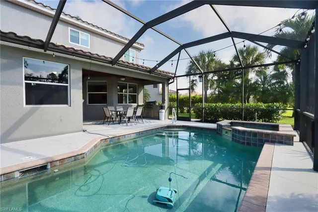 a view of a swimming pool with a patio