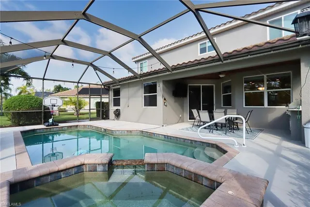 a view of a swimming pool with a patio