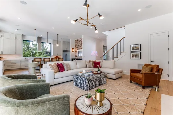 a living room with furniture or kitchen and a chandelier