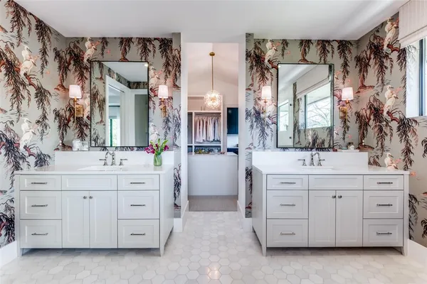 a bathroom with a double sink and a mirror