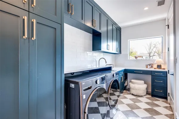 a utility room with cabinets