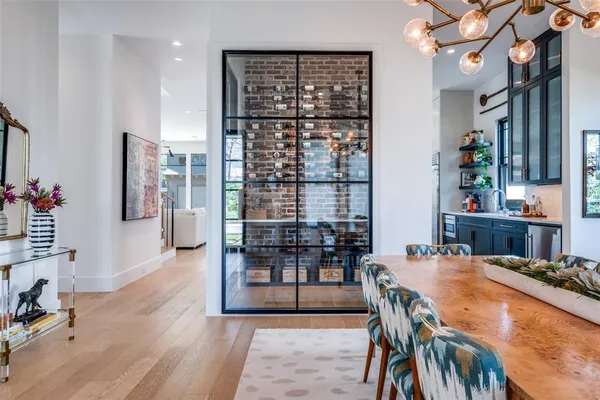 a view of a dining room with furniture and chandelier
