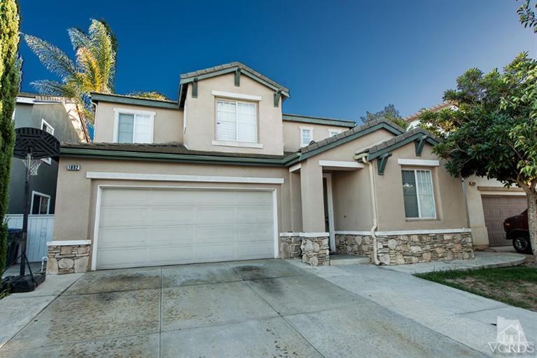 1892 Ribera Drive Oxnard, CA 93030 - Photo 1 of 34 a front view of a house with garage