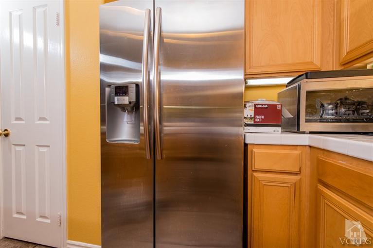 1892 Ribera Drive Oxnard, CA 93030 - Photo 16 of 34 a bathroom with a refrigerator and a sink