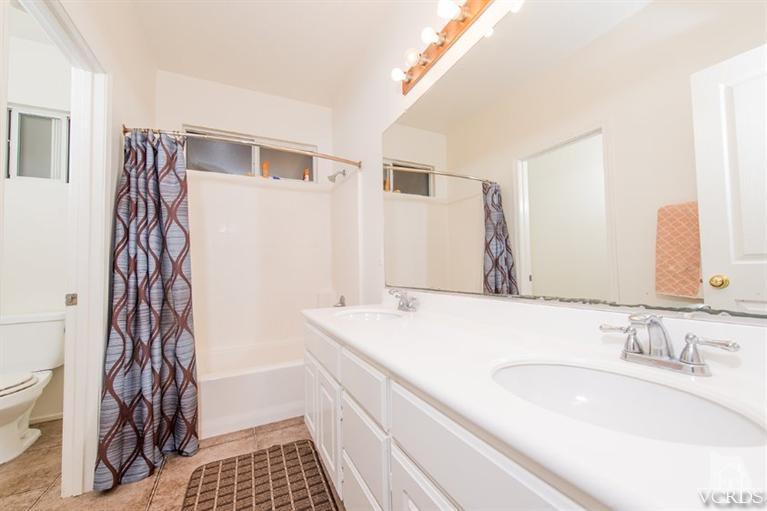 1892 Ribera Drive Oxnard, CA 93030 - Photo 20 of 34 a bathroom with a sink and a mirror