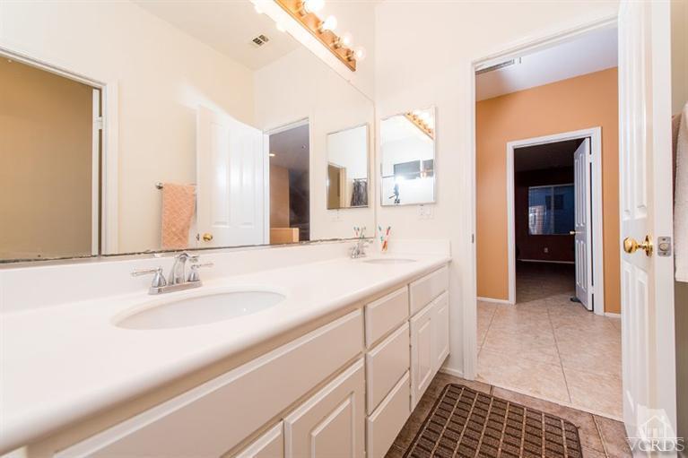 1892 Ribera Drive Oxnard, CA 93030 - Photo 21 of 34 a bathroom with a double vanity sink and a mirror