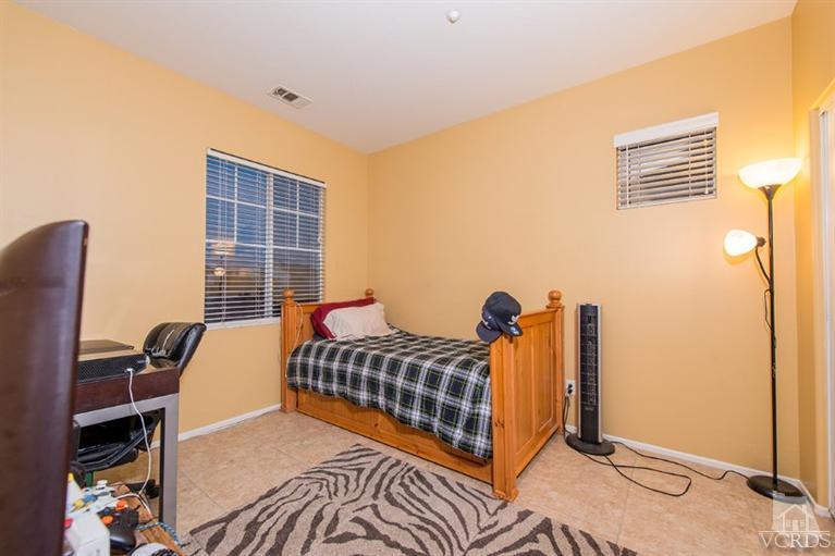 1892 Ribera Drive Oxnard, CA 93030 - Photo 22 of 34 a bedroom with a bed and a window