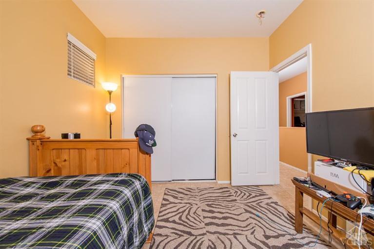 1892 Ribera Drive Oxnard, CA 93030 - Photo 23 of 34 a bedroom with a bed and a flat screen tv