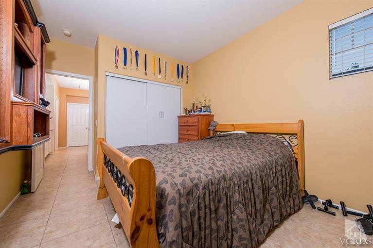 1892 Ribera Drive Oxnard, CA 93030 - Photo 24 of 34 a bedroom with a bed and wooden floor