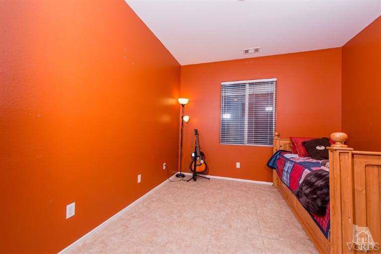 1892 Ribera Drive Oxnard, CA 93030 - Photo 25 of 34 a bedroom with a bed and a potted plant
