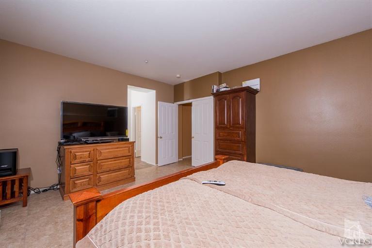 1892 Ribera Drive Oxnard, CA 93030 - Photo 28 of 34 a bedroom with a bed and a flat screen tv