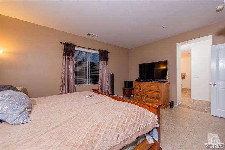 1892 Ribera Drive Oxnard, CA 93030 - Photo 30 of 34 a bedroom with a bed and a flat screen tv