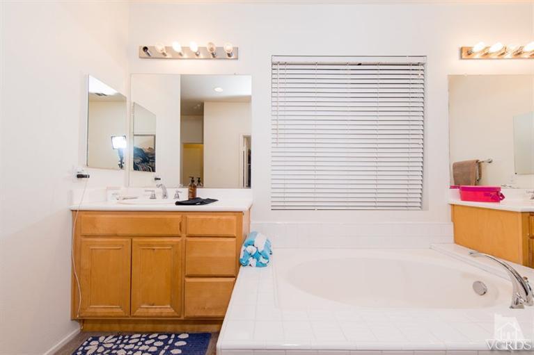 1892 Ribera Drive Oxnard, CA 93030 - Photo 33 of 34 a bathroom with a sink a vanity and a mirror