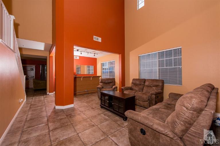 1892 Ribera Drive Oxnard, CA 93030 - Photo 6 of 34 a living room with furniture and a floor to ceiling window