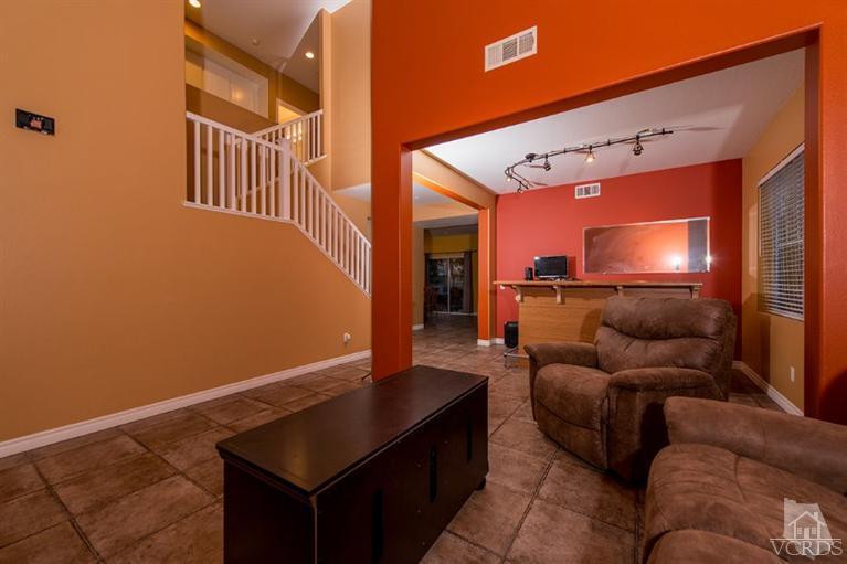 1892 Ribera Drive Oxnard, CA 93030 - Photo 7 of 34 a living room with furniture and a flat screen tv