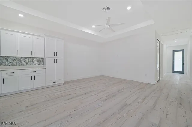 a view of a kitchen with wooden floor