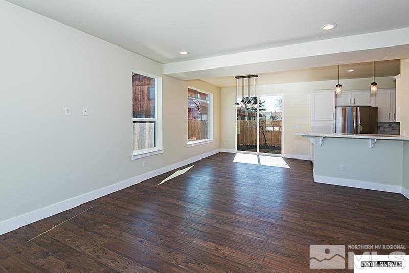 711 Roberts Street Reno, NV 89502 - Photo 5 of 13 a view of a big room with wooden floor and windows