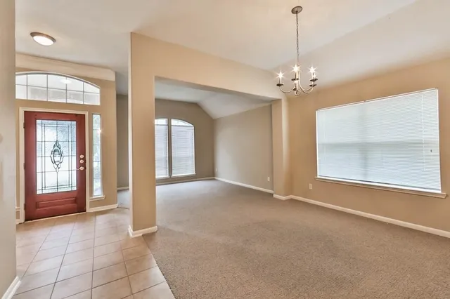 a view of an empty room and closet area