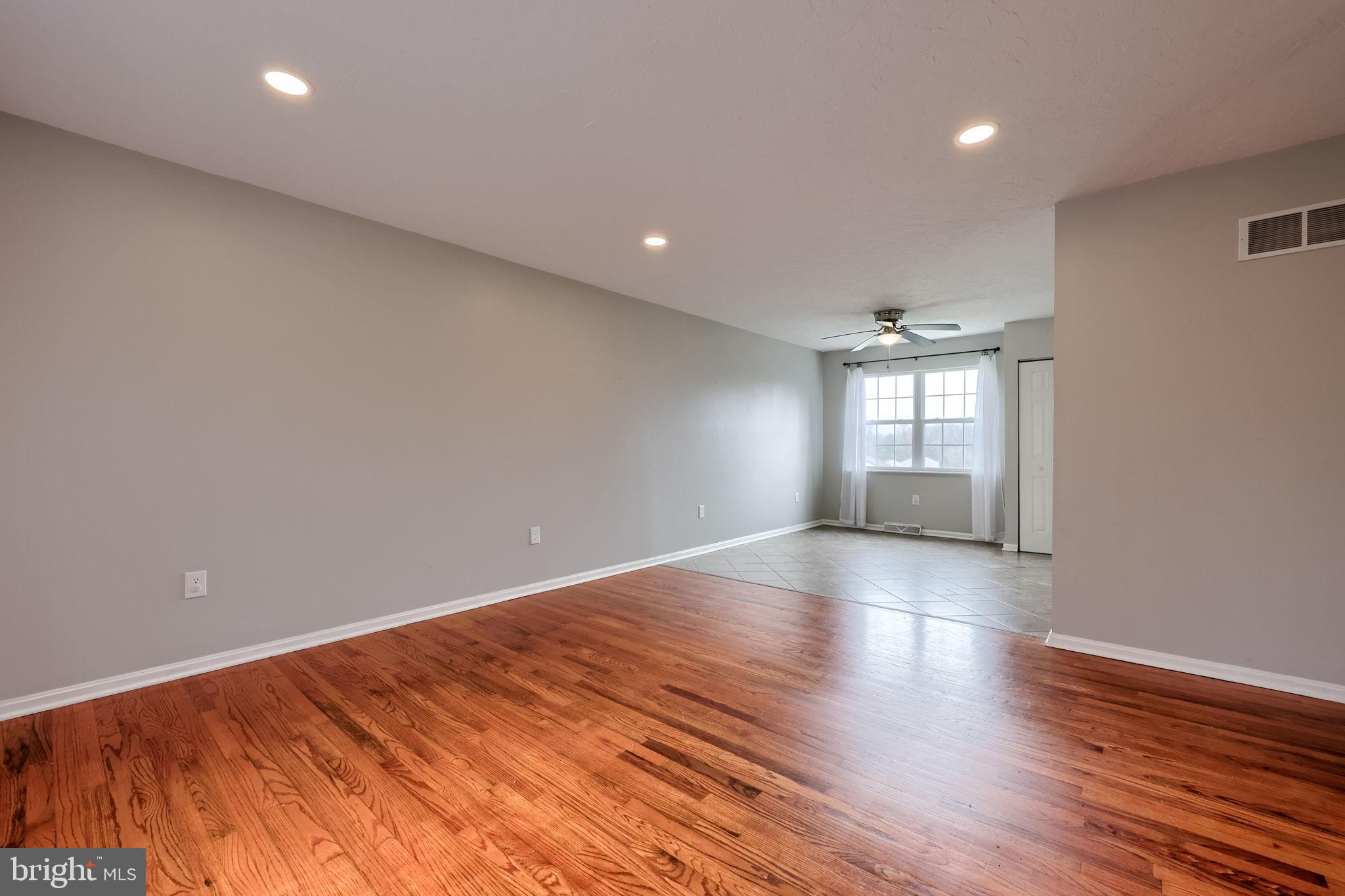 3333 Druck Valley Road York, PA 17406 - Photo 11 of 40 Spacious, sunlit living area with hardwood floors.