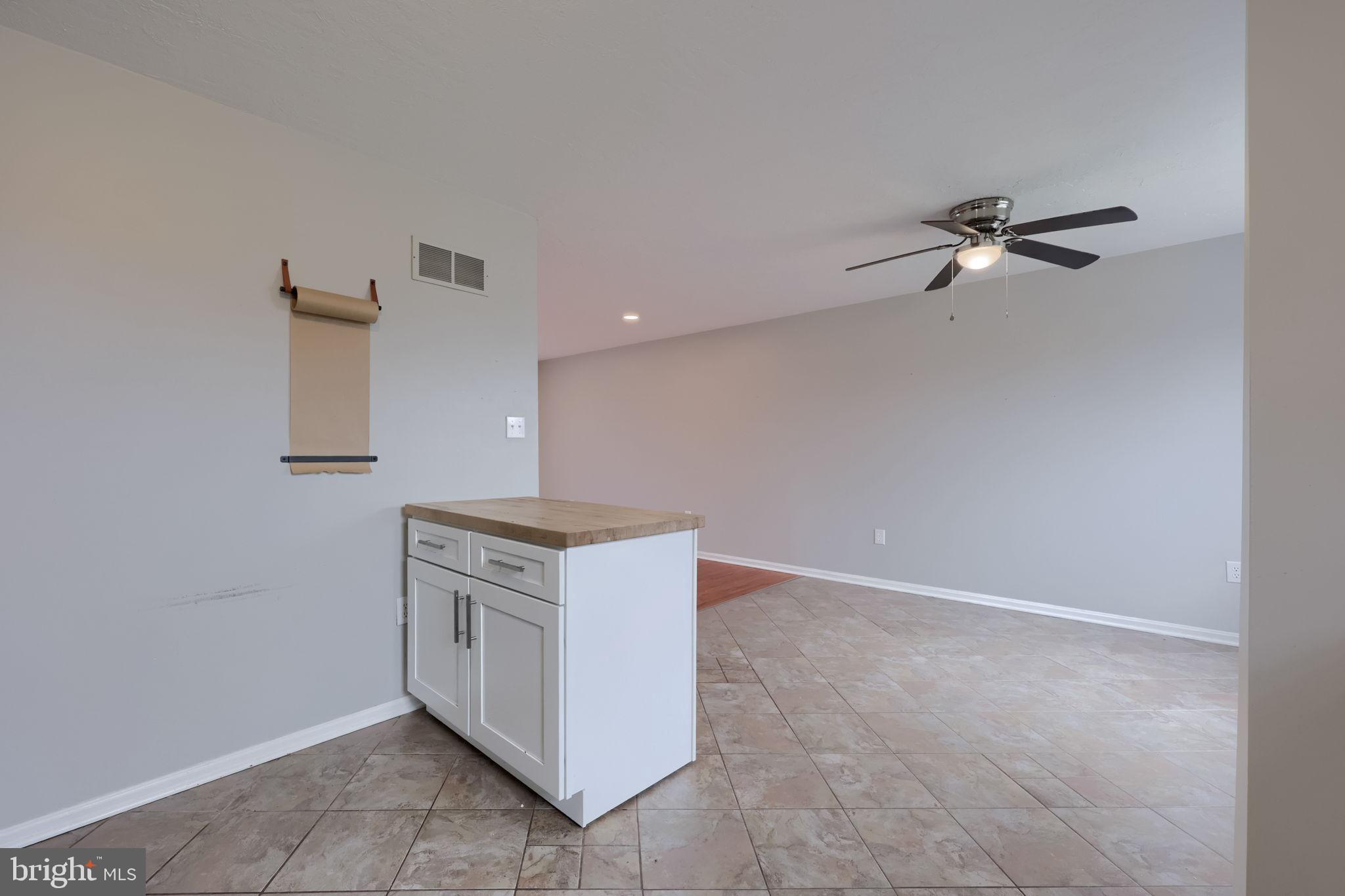 3333 Druck Valley Road York, PA 17406 - Photo 18 of 40 Spacious, modern living area with tile flooring.