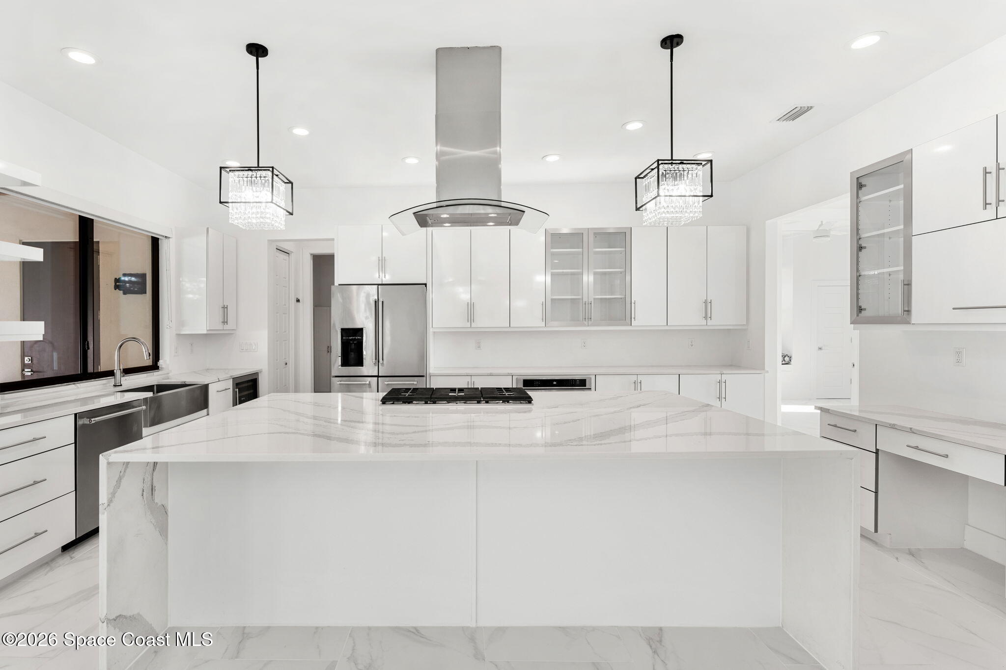 2355 North Riverside Drive Indialantic, FL 32903 - Photo 11 of 70 a view of a kitchen with kitchen island a counter top space appliances and cabinets