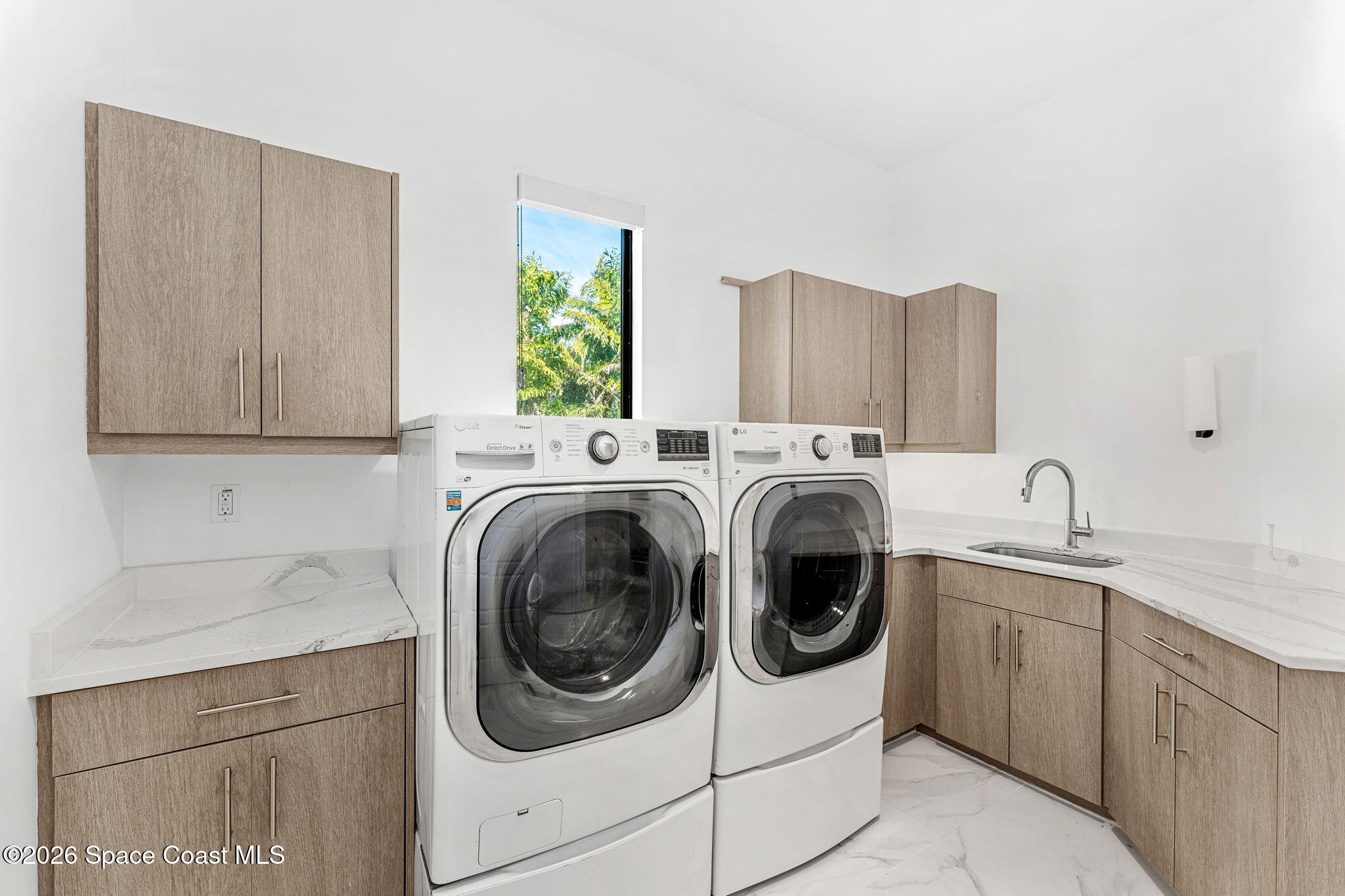 2355 North Riverside Drive Indialantic, FL 32903 - Photo 15 of 70 a utility room with sink dryer and washer